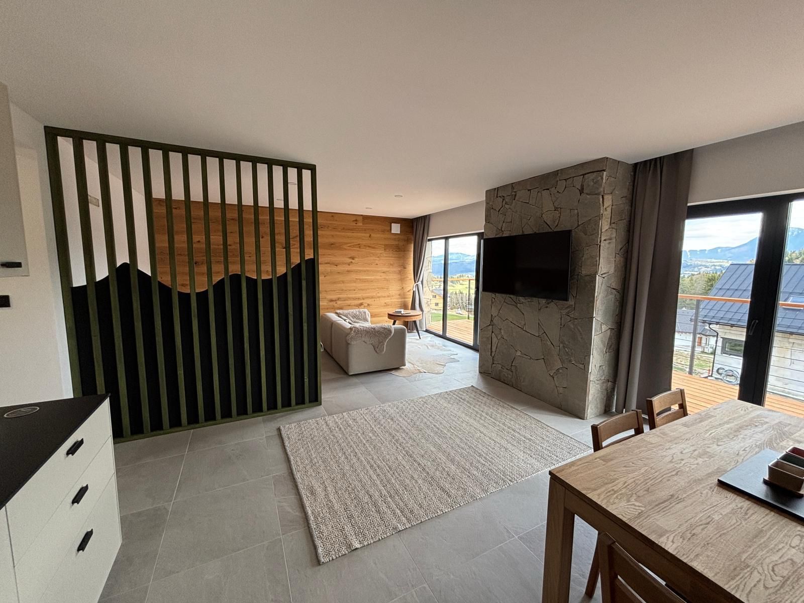 1st floor living room with stone feature wall