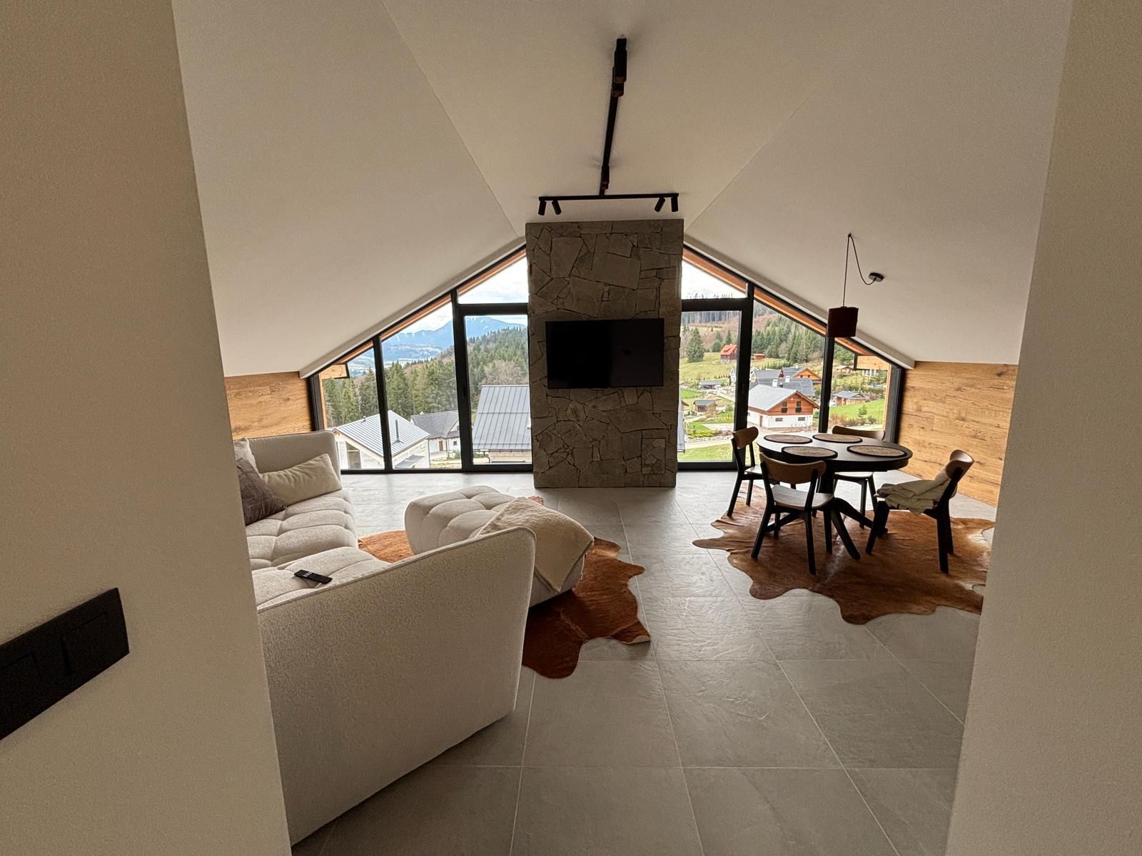 Attic living room with panoramic windows